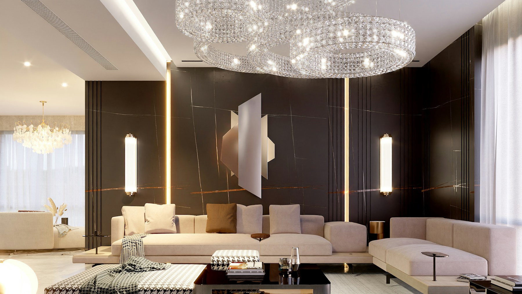 Luxury living room with a crystal chandelier, dark marble wall and cream seating